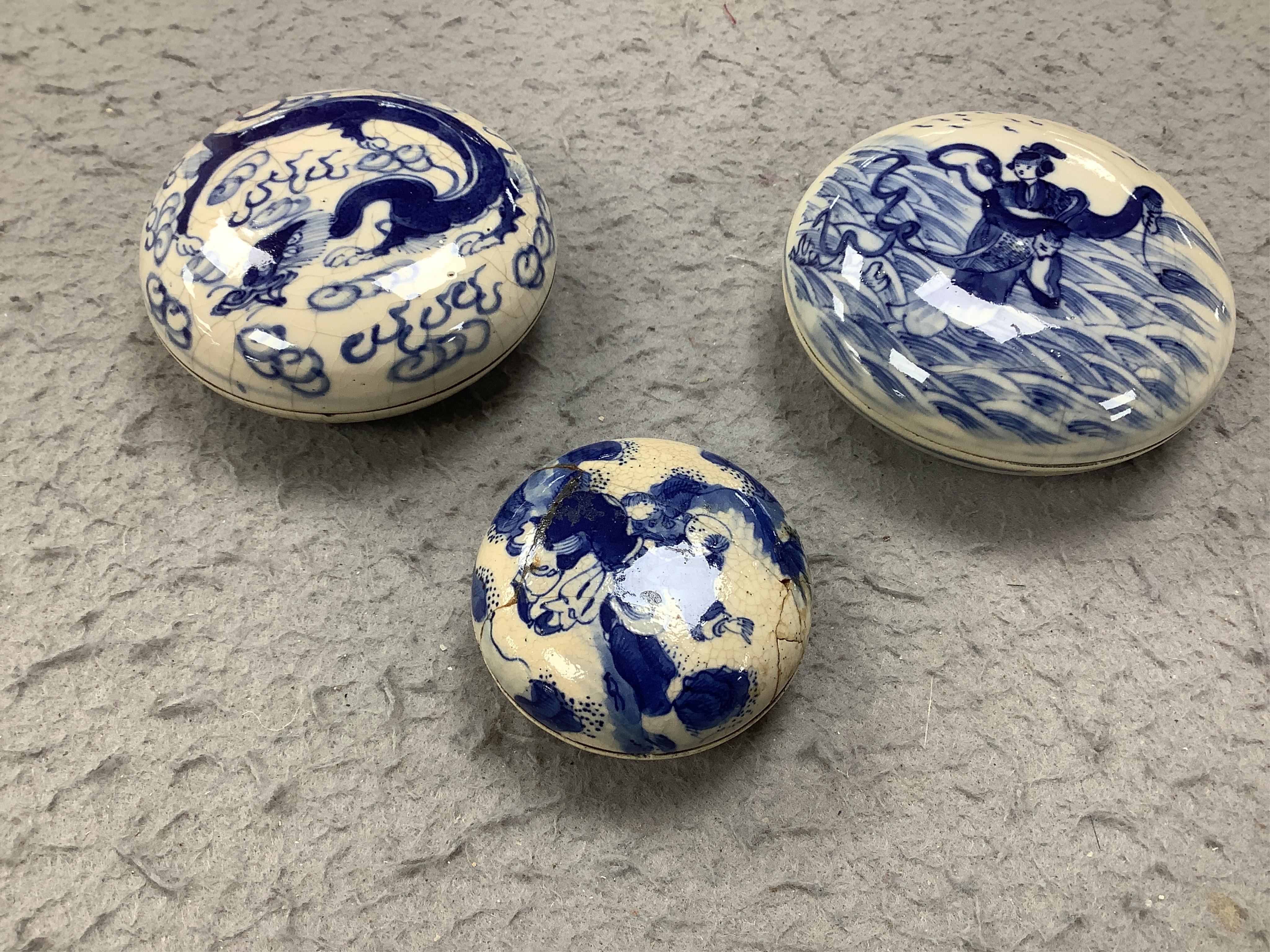 A Japanese eggshell tea and coffee set and three Chinese blue and white seal paste boxes and covers